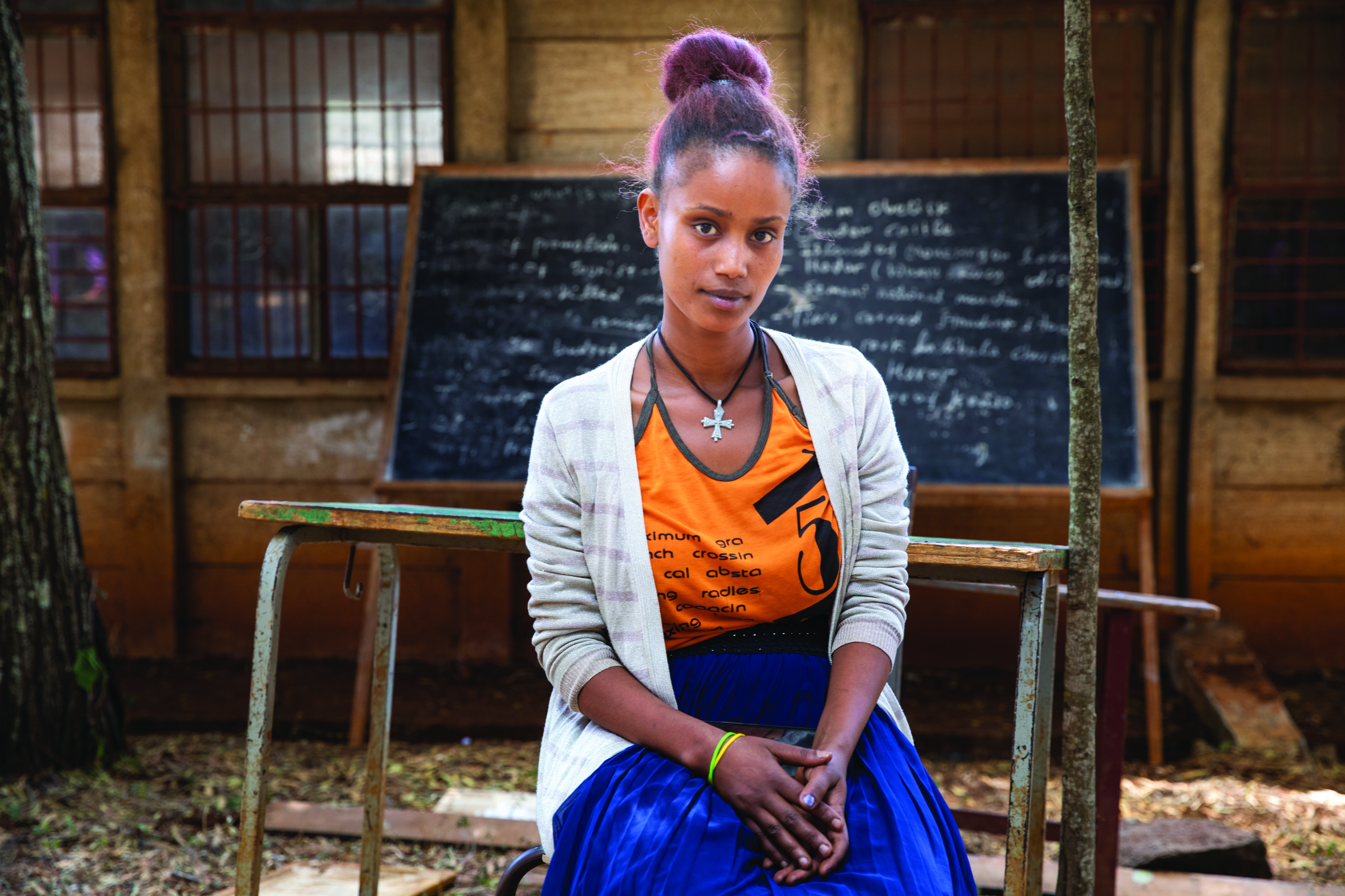 Young woman in classroom setting.