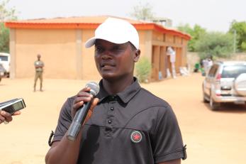 A youth connect participant speaking into a microphone.