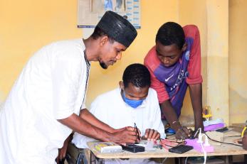 Cellphone repair education in the Sahel.